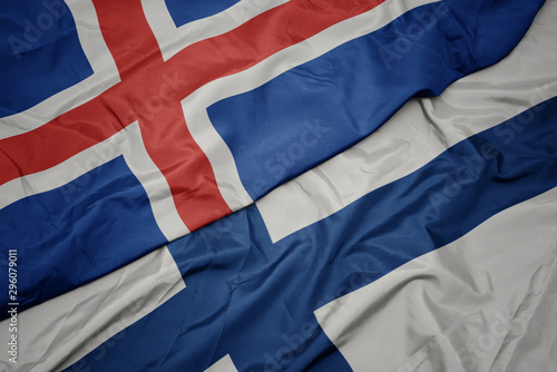 waving colorful flag of finland and national flag of iceland.