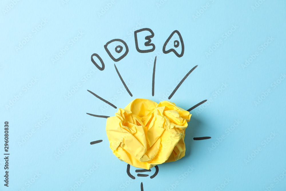 Drawn light bulb and paper ball on blue background. Good idea concept - obrazy, fototapety, plakaty 