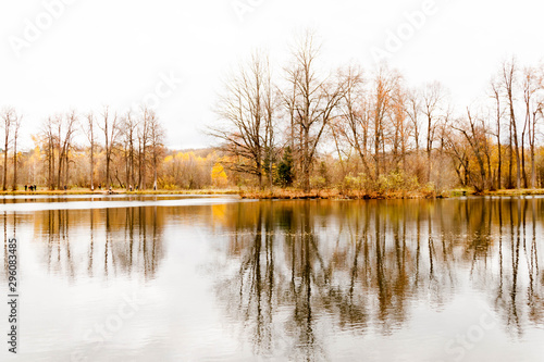 Russia, Moscow Region - October 13, 2019: Beautiful autumnal view of pond in manor Serednikovo in Firsanovka. photo