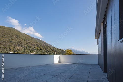 Large terrace with large marble tiles overlooking the Swiss hills in Ticino
