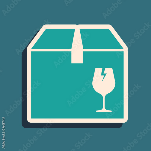 Green Delivery package box with fragile content symbol of broken glass icon isolated on blue background. Box, package, parcel sign. Long shadow style. Vector Illustration