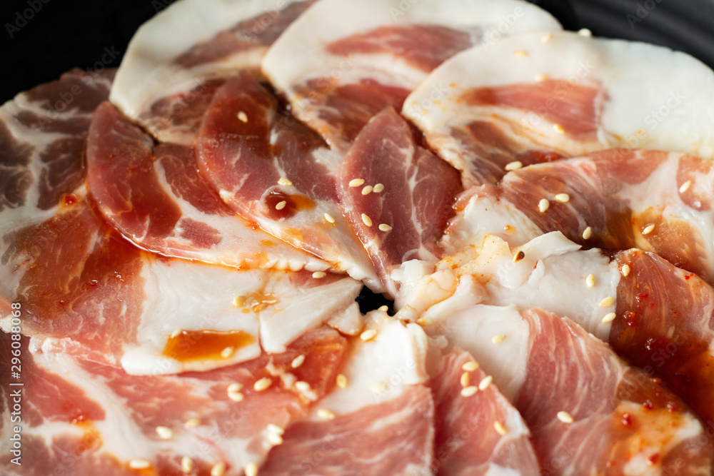 uncook kurobuta slice pork pig with seasoning close-up uncook kurobuta slice pork pig with seasoning close-up
