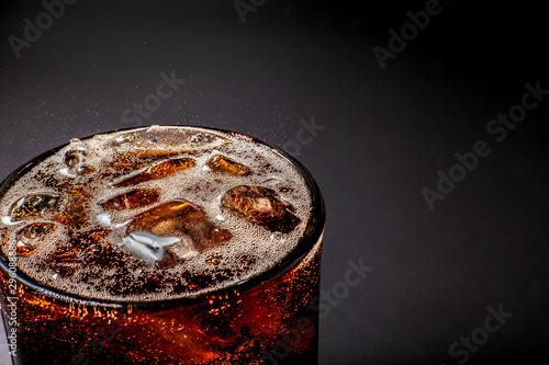 Fizz sparkling Cola water Refreshing bubbly Soda Pop with Ice Cubes. Cold soft drink cola carbonated liquid fresh and cool iced drink in a glasses . Refreshing and quench thirst concept .