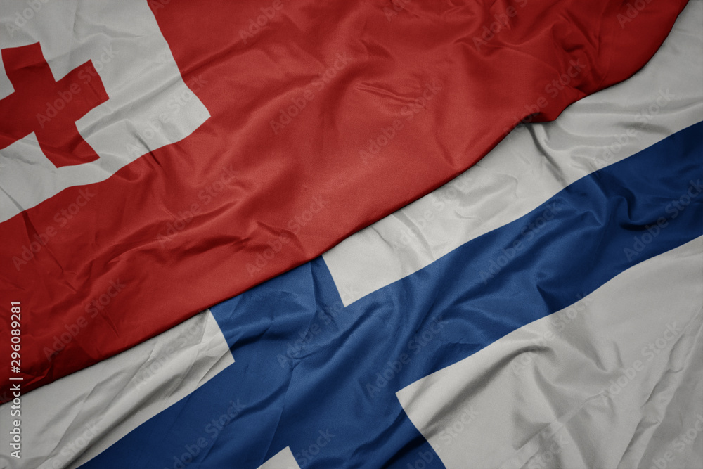 waving colorful flag of finland and national flag of Tonga . waving colorful flag of finland and national flag of Tonga .
