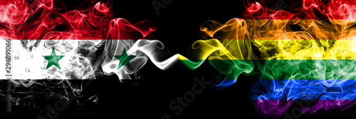 Syria vs Gay pride smoke flags placed side by side. Thick colored silky smoke flags of Syrian and Gay pride photo