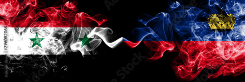 Syria vs Liechtenstein, Liechtensteins smoke flags placed side by side. Thick colored silky smoke flags of Syrian and Liechtenstein, Liechtensteins photo