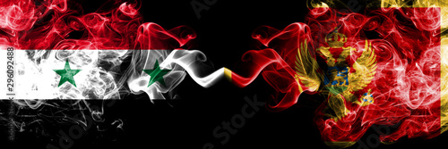 Syria vs Montenegro, Montenegrin smoke flags placed side by side. Thick colored silky smoke flags of Syrian and Montenegro, Montenegrin photo