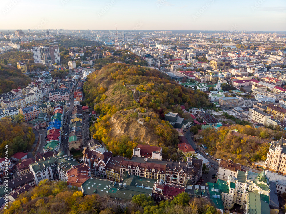 Aerial top view of Kyiv cityscape of Vozdvizhenka and Podol historical districts on sunset from above, city of Kiev, Ukraine