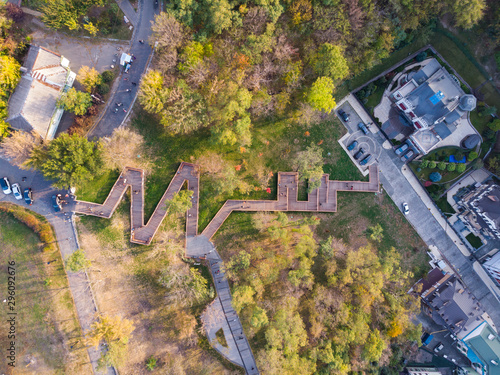 Aerial top view of Kyiv cityscape of Vozdvizhenka and Podol historical districts on sunset from above, city of Kiev, Ukraine