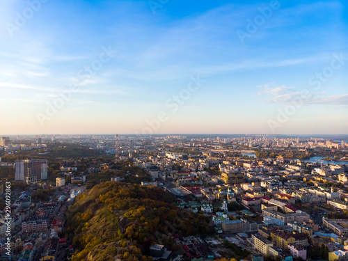 Aerial top view of Kyiv cityscape of Vozdvizhenka and Podol historical districts on sunset from above, city of Kiev, Ukraine