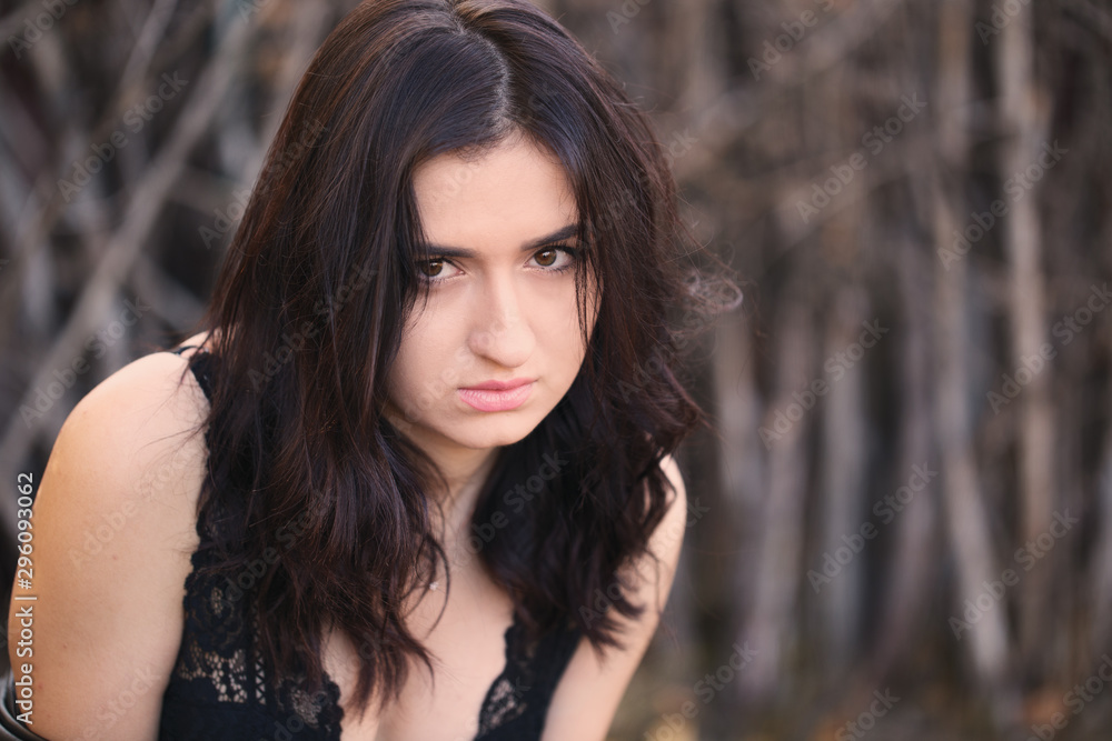 Portrait of glamour brunette model on autumn landscape background Portrait of glamour brunette model on autumn landscape background