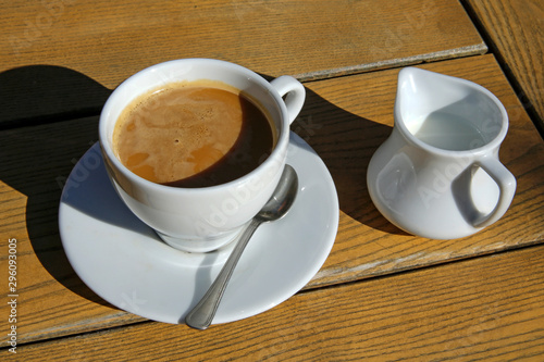 coffe with milk cup on wooden table