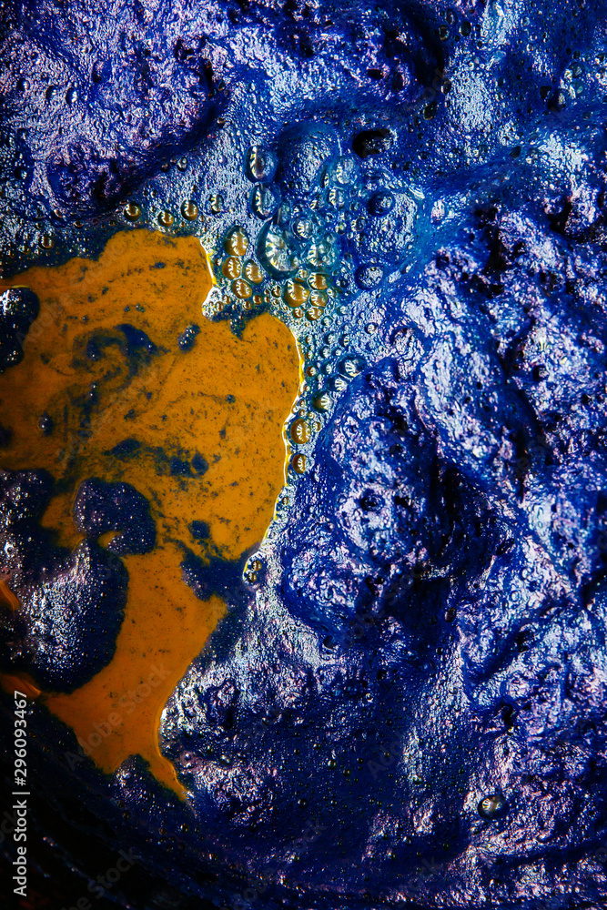 Fototapeta premium Thai traditional fabric process. Close Up of Indigo plant fermentation. Natural dyeing fabric with indigo water. Manufacture of natural dyeing color. Indigo background