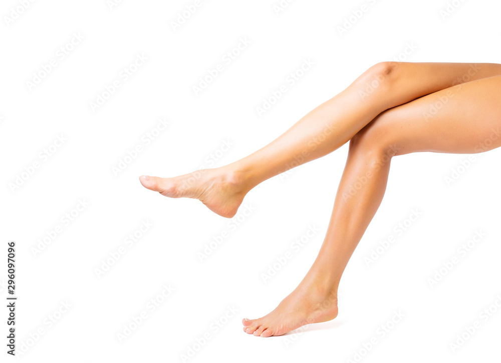 Pretty bare woman's legs isolated on white background
