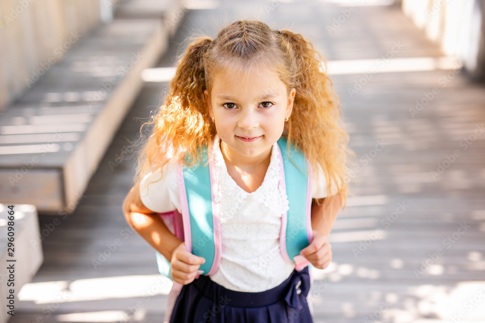 Happy little schoolgirl with apple. Back to school outdoor Happy little schoolgirl with apple. Back to school outdoor