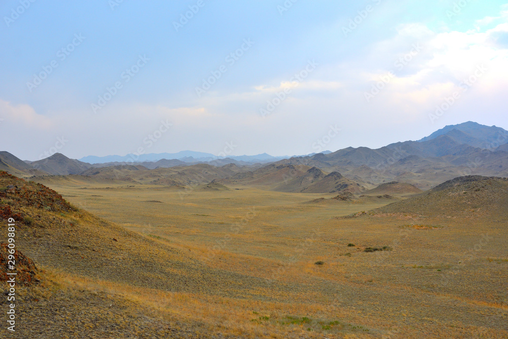 Mountains with yellow grass on autumn in Kegen region of Kazakhstan