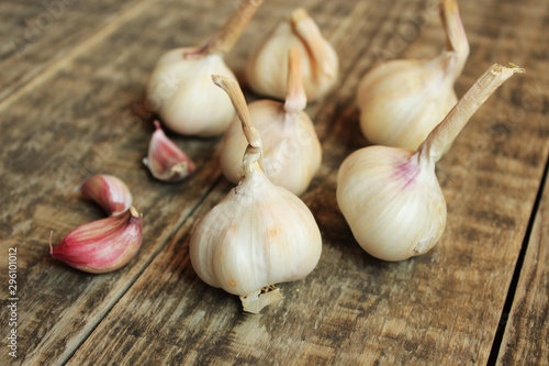  Garlic on a background of wooden boards. Useful spice.