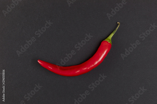 Red hot chili pepper on black background