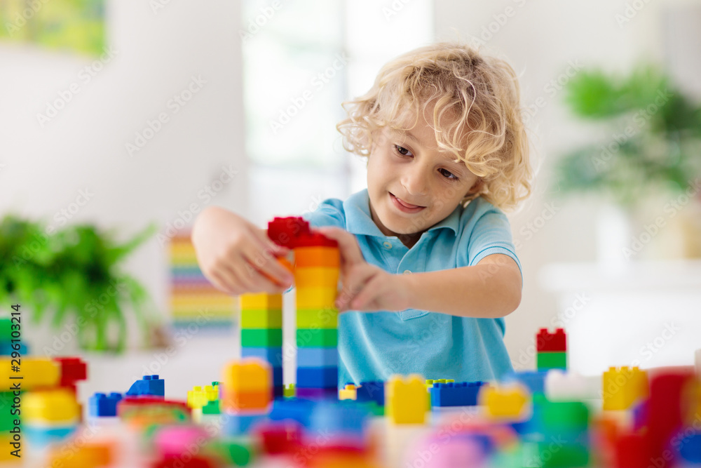 Child playing with toy blocks. Toys for kids. Child playing with toy blocks. Toys for kids.