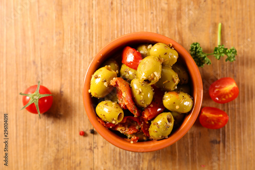 olive and dried tomato, antipasto on wood background