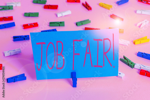 Writing note showing Job Fair. Business concept for event in which employers recruiters give information to employees Colored clothespin papers empty reminder pink floor office pin photo