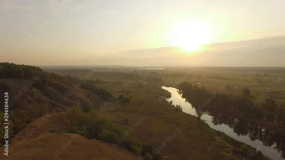 Dawn in the sleeping area of a small town with a forest on the background. View from a height Dawn in the sleeping area of a small town with a forest on the background. View from a height