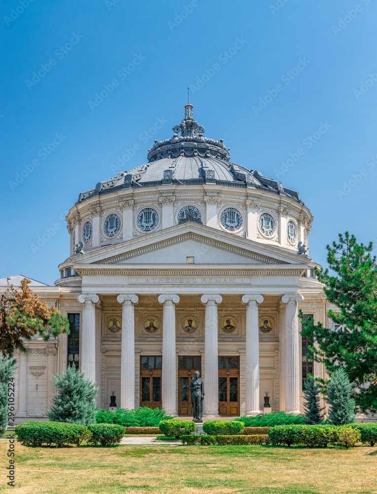 Romanian Athenaeum, a concert hall in the center of Bucharest, Romania and a landmark of the Romanian capital city. Romanian Athenaeum a sunny summer day with blue sky in Bucharest, Romania