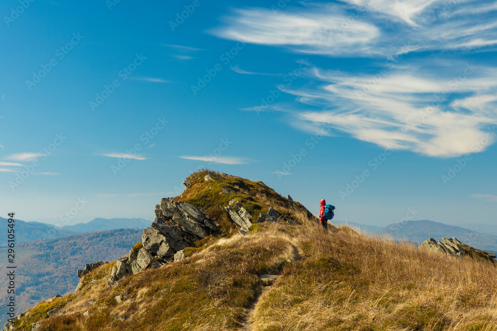 tourism in mountain life style concept wallpaper poster photography of backpacker woman near picturesque rock scenic landscape gorgeous environment in Switzerland hiking time, copy space for text 