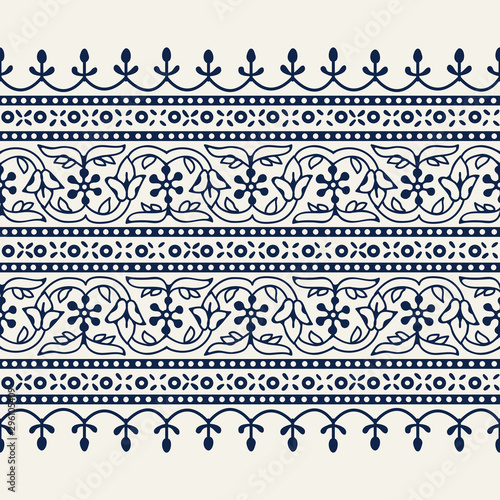 Woodblock printed indigo dye seamless ethnic floral wide geometric border. Traditional oriental ornament of India Kashmir, flowers wave and arcade motif, navy blue on ecru background. Textile design.