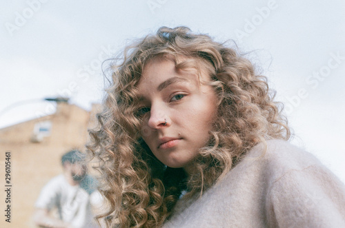 Fotografie Close up portrait of young beautiful woman with gorgeous curly hair
