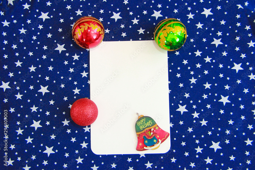 New Year white card on a blue background with white stars and toys balls for the Christmas tree New Year white card on a blue background with white stars and toys balls for the Christmas tree