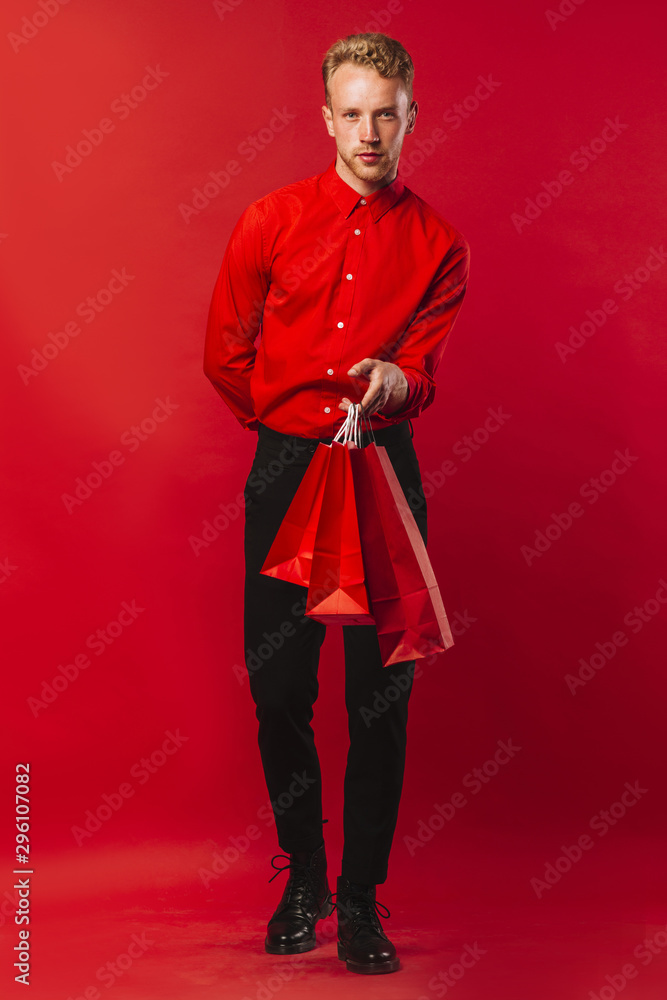 Handsome adult male with shopping bags