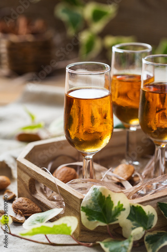 Italian almond liquor amaretto on a wooden table