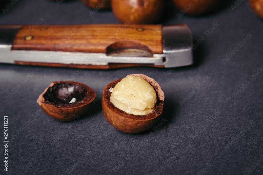 Several macadamia nuts on a black background Several macadamia nuts on a black background