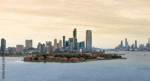 View of Ellis Island with Jersey City and Manhattan Island in the background.