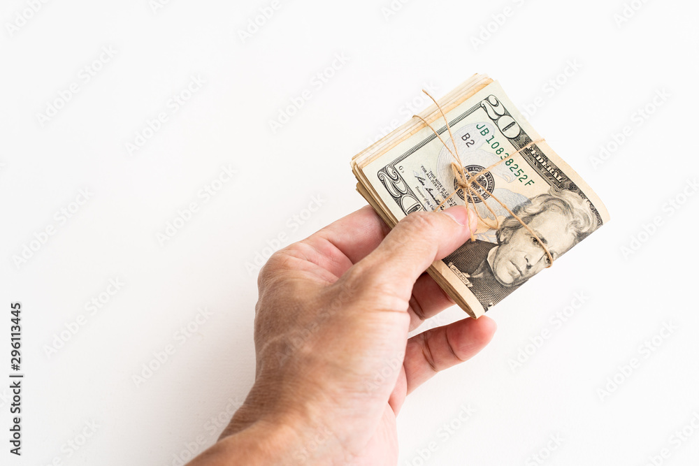 Hand holding American dollars banknote on white background Hand holding American dollars banknote on white background