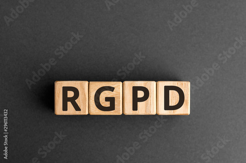 RGPD - French: Reglement general sur la protection des donnees means: Spanish, French and Italian version of GDPR - General Data Protection Regulation, RGPD concept,  top view on grey background photo