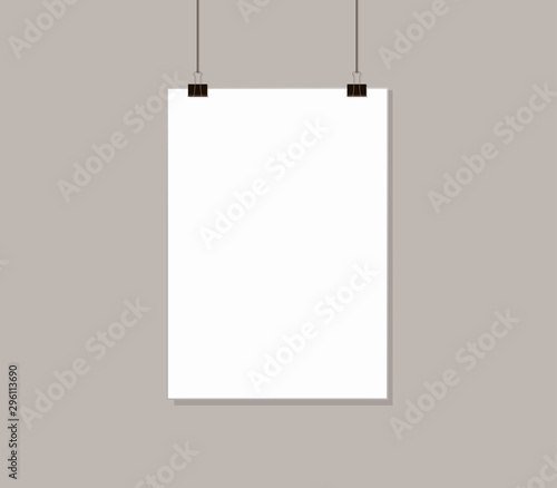 White poster mock up hanging on rope with paper clips near grey wall. Blank Canvas Mockup design template.