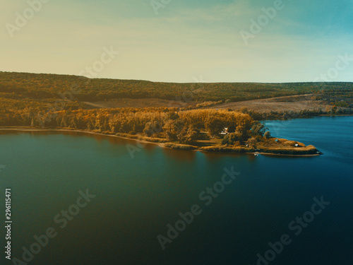 Fototapeta Naklejka Na Ścianę i Meble -  Drone photo from above the lake at sunset during autumn season