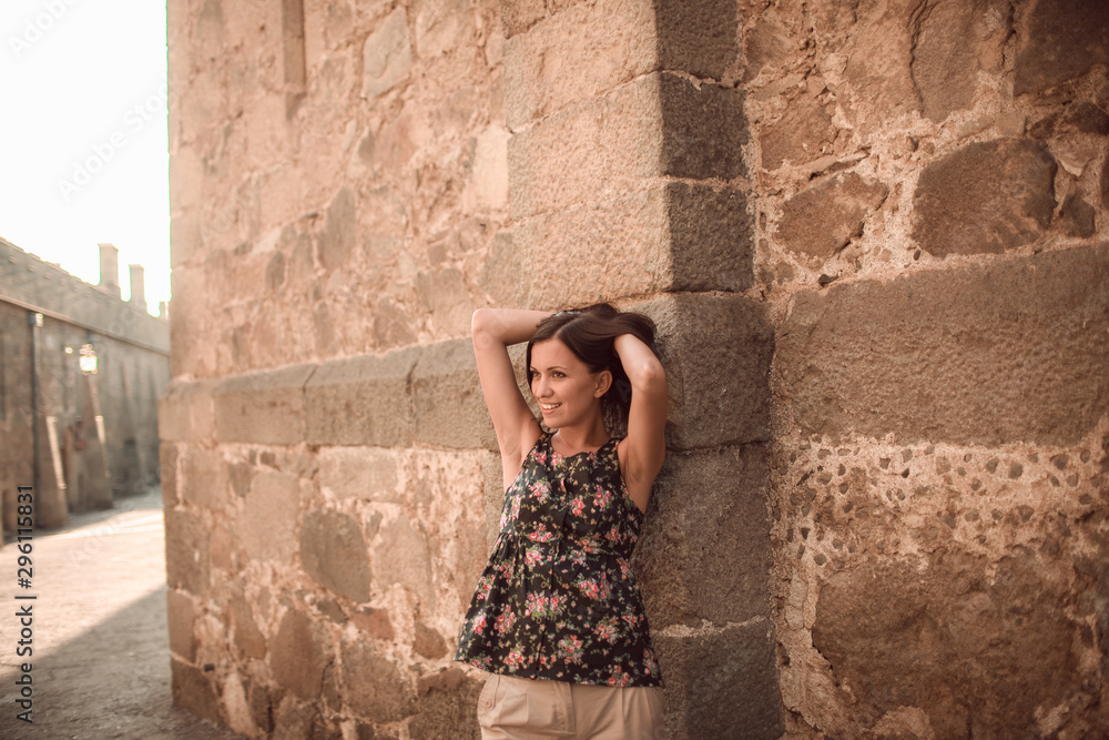 Young woman tourist posing at beautiful place