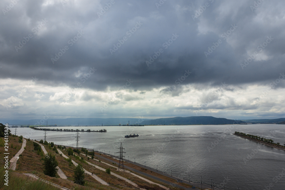 Volga river and breakwater in cloudy weather