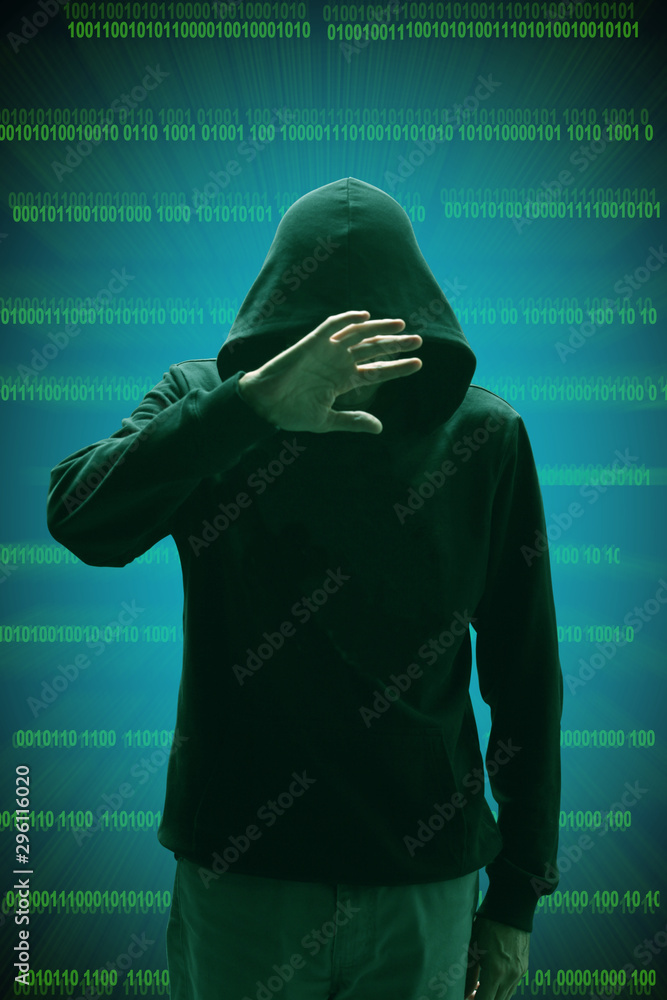 unrecognizable black hooded hacker standing with binary codes on transparency unrecognizable black hooded hacker standing with binary codes on transparency