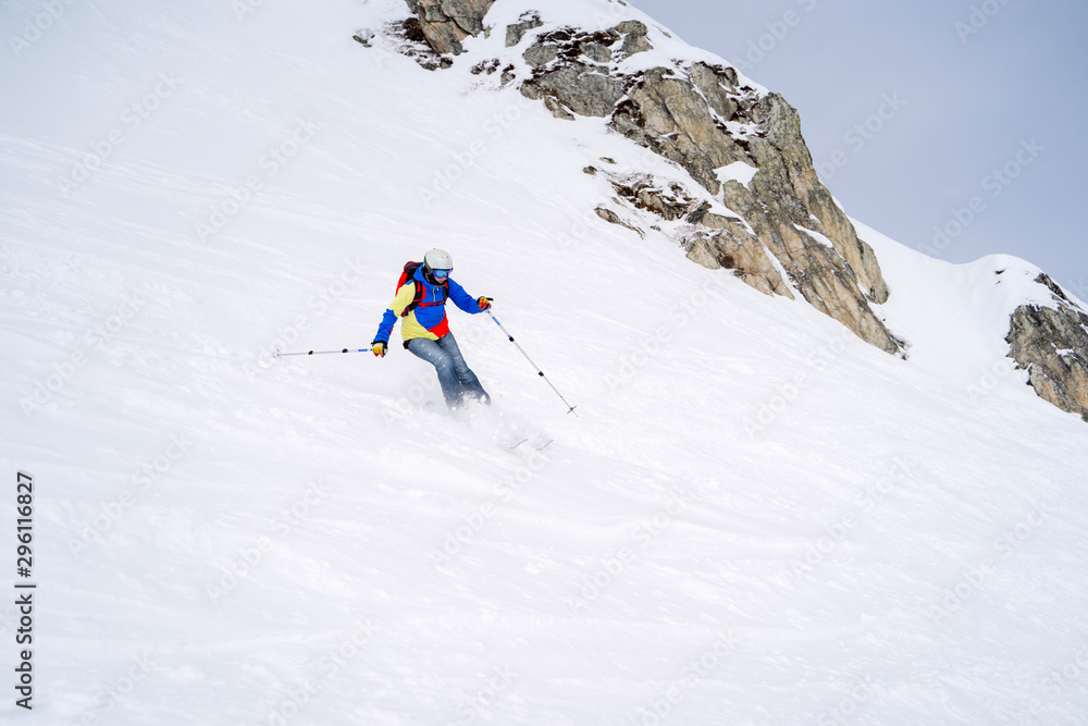 Sports woman skiing on snowy slope.