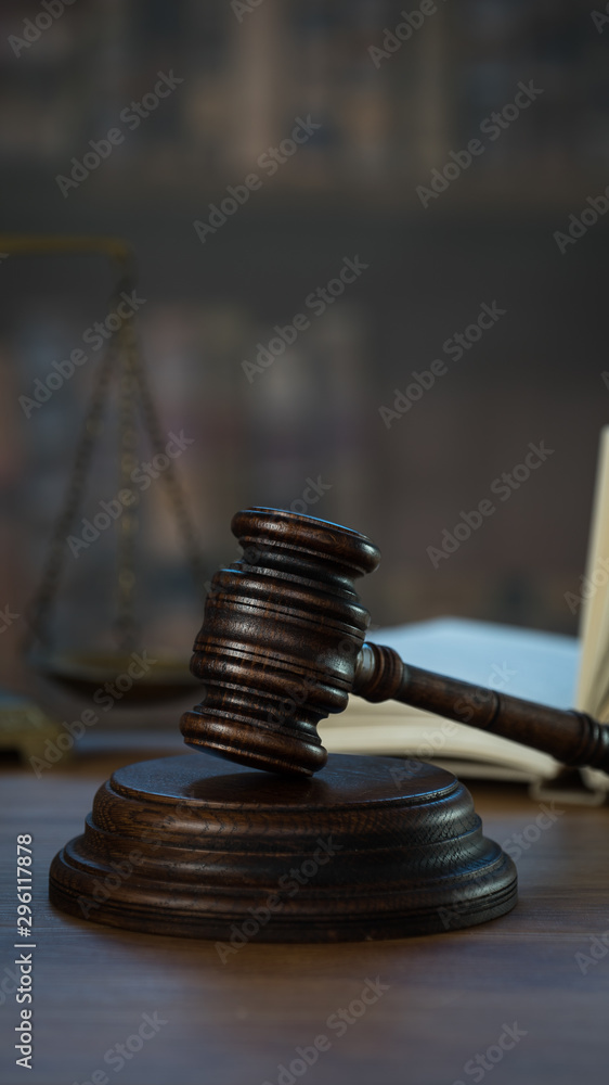 Law and Justice concept. Mallet of the judge, books, scales of justice. Courtroom theme. Law and Justice concept. Mallet of the judge, books, scales of justice. Courtroom theme.