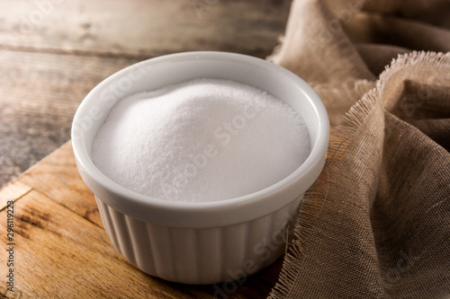 Baking soda in white bowl on wooden table © chandlervid85