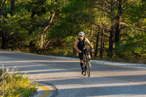 male biker cycling on a mountain road