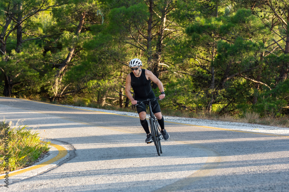 male biker cycling on a mountain road