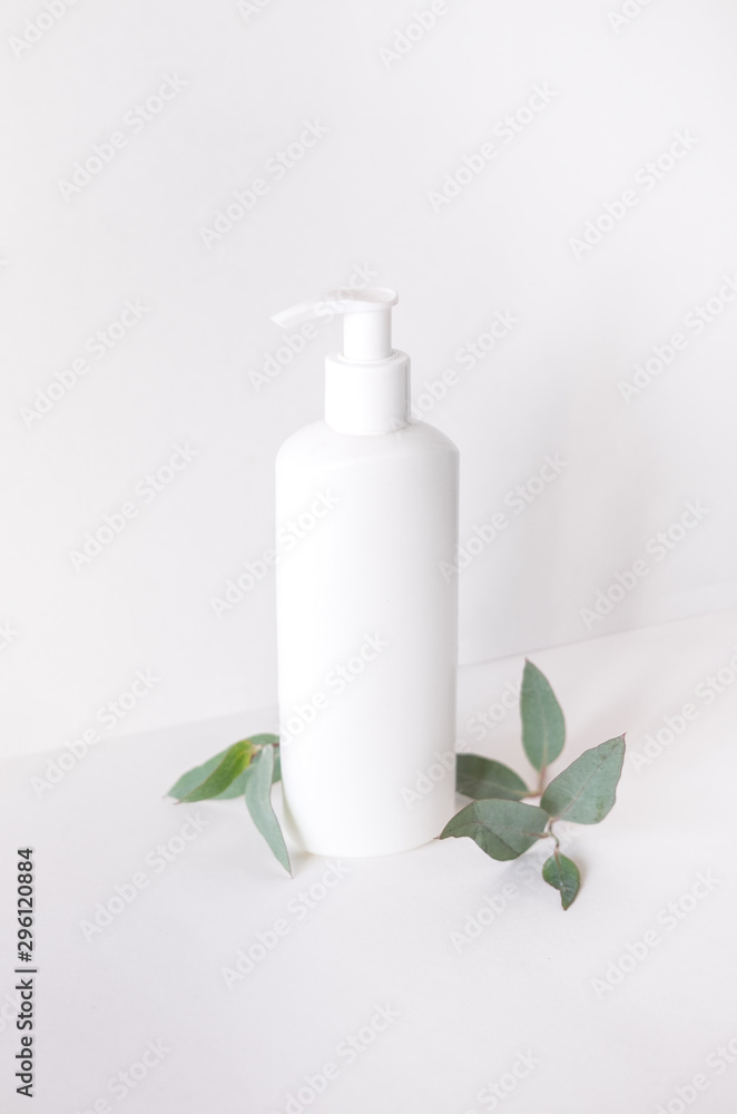A mock-up bottle on a light minimalistic background. A mock-up bottle on a light minimalistic background.