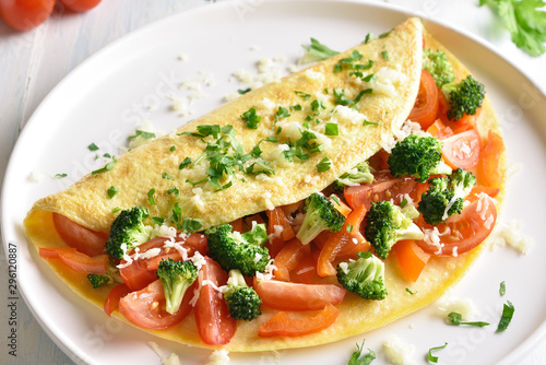 Stuffed omelette with tomatoes, red bell pepper and broccoli