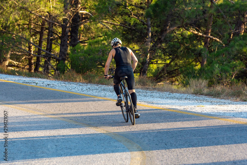 male biker cycling on a mountain road © araelf